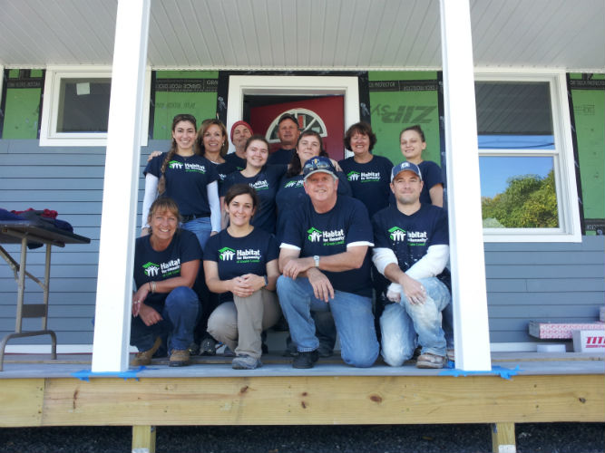 CCS staff building a house with Habitat for Humanity